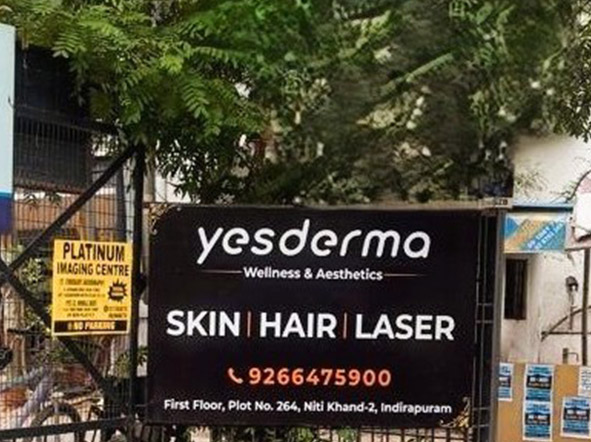 Dermatologist examining a patient's skin